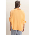 Relaxed High-Low Batwing Sleeve Top