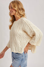 OVERSIZED BELL SLEEVE CABLE KNIT SWEATER