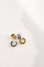 Ezri Crystal Cross Huggie Earrings